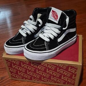 Vans Black and White High-Tops with Red Logo